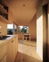 Smaller windows are placed in the kitchen area and the sleeping loft. 