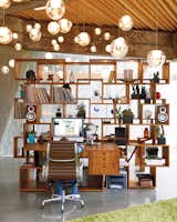 #office #lighting #circleceilinglamp #bookcase #stackedshelving #woodshelving #interior #inside #workspace #storage #squareshelving #modern