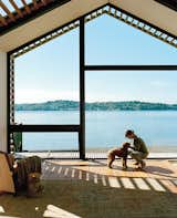 #shorefront #beachhouse #pets #pine #purlinswindow #reclaimedwood #glassfacade #naturallighting #interiordesign #fabricpanels #whitesunbrella #grizzle 