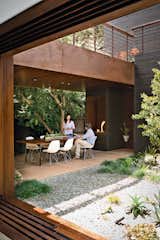 #outdoor #indoor #outdoorindoorliving  #modern #fireplace #outdoorfireplace #diningroom #patio #sparkmodernfires #diningroomtable #woodtable #family #familyhouse #architecture #succulence #eameschair   Search “woodtable” from Favorites