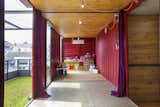 #shippingcontainer #exterior #modern #steel #color #interior #cherryred #red #woodceiling #wood #patio #greenspace #roof #extension #indonesia #greenroof #playroom #children #family 