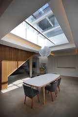 #interior #dining #modern #table #diningarea #naturallighting #skylight #london #jamesburleigh #brick #industrial #woodwall 