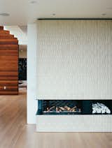 #interior #fireplace #modern #livingroom #whitewall #ceramic #heathceramics #tile #lowslungfireplace #lowslung #oakfloor #woodfloor #ceramiclogs #KleinReid #sanfrancisco #renovation 