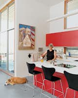 #kitchens #indoor #inside #interior #modern #midcentury #minimal #function #red #cabinets #island #stools #color #dog #Varenna #NewMexico