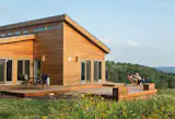#prefab #modern #structure #shape #form #exterior #outside #outdoors #landscape #deck #seating #view #modular #hillside #BluHomes #TimWright #WisconsinBalanceHouse