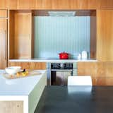 #kitchens #modern #midcentury #interior #inside #indoors #lighting #geometric #glass #tile #backsplash #induction #cooktop #Crate&Barrel #IslandStone #Bosch #1968 #Reno #HobsonRenovation #Hawkins&Associates