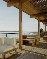 #beachhouses #exterior #outside #outdoors #modern #midcentury #landscape #deck #seating #wood #panels #view #porch #indooroutdoorliving #TamarkinResidence #TamarkinCo.

