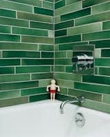 #modern #moderndesign #bath&spa #bathroom #interior #color #colortile #greentile #heathtile #midcentury #faucet #bathroomfixtures #toys