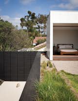 #outdoor #outside #exterior #modern #architecture #landscape #woodfence #deck #lowmaintenance #backyard #rockgarden #sebastianmariscalstudio #wabihouse #bedroom #openfloor #indooroutdoor #limestone #clad #secondstory #mastersuite roofdeck #plants 