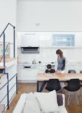 White Cabinet, Dining Room, Chair, and Table Called the “LDK,” for living, dining, and kitchen, the space is flexible—a blend of Western loft life and traditional Japanese homes, where rooms are multipurpose.  Search “8 living rooms we love” from Small Box Home With Black Metal Facade in Japan