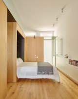 In the guest room, for example, the built-in unit contains a pull-down Murphy Bed, which makes the most of the elongated space.