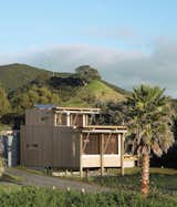 On New Zealand’s Great Barrier Island, two architects designed a petite holiday home that takes care of its own water, electricity, and sewage needs.  Photo 3 of 10 in Noteworthy Sustainable Homes by Jami Smith from Small Spaces in Rural Places