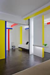 Taking cues from Piet Mondrian's iconic Broadway Boogie Woogie painting, architect and critic Joseph Giovannini recasts a New York City studio apartment.  Photo 5 of 5 in How to Decorate With Yellow (Without the Smiley-Face Connotations) by Heather Corcoran from Primary Colors in Home Design