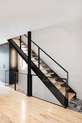 Breaking away from the traditional town house, the custom-designed stairs make the most of the space while looking sleek.