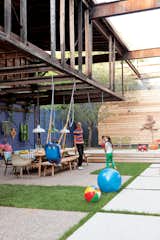 Outdoor and Grass With ingenuity and plenty of elbow grease, architect John Tong turned an old Toronto dairy into the ultimate family clubhouse. Photo by Christopher Wahl.  Photo 1 of 13 in Play’s the Thing