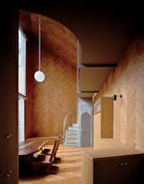 Masahiro and Mao Harada of Mount Fuji Architects Studio wanted to break with the traditional definition of a house when they designed this small Tokyo home. They achieved their goal by using the same wood material for the ceiling, the walls, and the floor, creating a space that flows beautifully. 
