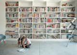 One wall of the living room houses a library.