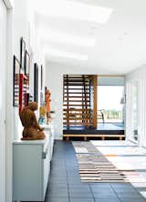 Staircase and Wood Tread “The hallway and courtyard are synonymous with each other visually, which has this very joyful quality about it,” says architect David Salmela.  Photo 2 of 8 in A Modern Lakeside Home in Wisconsin