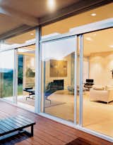 Doors, Sliding Door Type, Exterior, and Metal The living room utilizes Eames lounges and a B&B Italia sofa to create a spare but comfortable environment. Sliding glass doors provide ample ventilation.  Photo 2 of 6 in Modern Across America: Salt Lake City from Modern Awakening