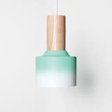 Hombre pendant light by Damm. St. Petersburg, Florida–based design studio Damm worked with motorcycle painters to achieve the gradient finish on its ten-inch tall ceramic-and-ash pendant light.