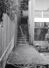 The original exterior had Astroturf-covered stairs.  Photo 13 of 15 in A Midcentury Home’s Past Mistakes Are Finally Corrected