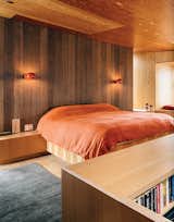 After buying a site overlooking an inlet called Smuggler’s Cove, Gabriel Ramirez asked two architects—Norman Millar, dean of the Woodbury School of Architecture, and Judith Sheine, head of the architecture department at the University of Oregon—to design the house. Boi sconces, which David Weeks designed for Ralph Pucci, illuminate the bedroom in this Sea Ranch residence.