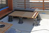 For three outdoor decks we specified a decking system from Eco Arbor Designs in San Diego, CA. The system comprises of structural Ipe deck tiles and pedestals which can adjust for height and slope. In this image we are testing various pedestal settings.  Photo 6 of 15 in Dwell Home Venice: Part 22