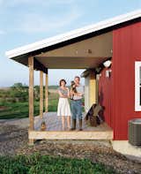Geoff and Joanna Mouming’s compact modern farmhouse is the first permanent structure at Yum Yum Farm in Wellman, Iowa. On the field that stretches out before it, organic vegetables will soon make attentive farmers of the Moumings. The benches on their entry porch were built by Geoff using a design plan by Aldo Leopold, the pioneering Iowa-born conservationist and writer whose spirit and thoughts seem to preside over the house.