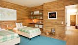Bedroom and Bed Lang Architecture designed the simple plywood beds, set on casters, in Nico's room. A carpenter assembled them at the building site.  Photo 4 of 10 in An Enclave of Modern Cottages in New York's Hudson Valley