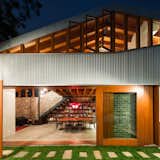 Australian firm Carterwilliamson Architects converted a 19th-century cow shed into a residence that implements passive heating and cooling principles. "Our clients share a vision for gregarious family life which is reflected in their home. The spaces are truly ‘open plan. Each room is connected to the others and to the sunny, green courtyard that acts as a natural extension of the living spaces," says firm principal Shaun Carter.