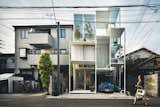 House NA from 2011 has glass walls and a steel structural frame containing a matrix of tiny rectangular rooms and outdoor terraces, each on a separate floor level linked by stairs, ladders, or movable steps. Hemmed in by neighboring homes on three sides and a narrow street in front, the house belongs to a couple clearly at ease with Tokyo’s urban condition.