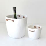 TINA FREY ICE BUCKET

Modern and playful, the Ice Bucket is designed and hand-sculpted by Tina Frey in San Francisco. Made from shatterproof and food-safe resin, the Ice Bucket’s clean modern lines are complemented by organic and supple leather handles making it easy to carry.  Search “resin-champagne-bucket.html” from Small Space Holiday Cocktail Party