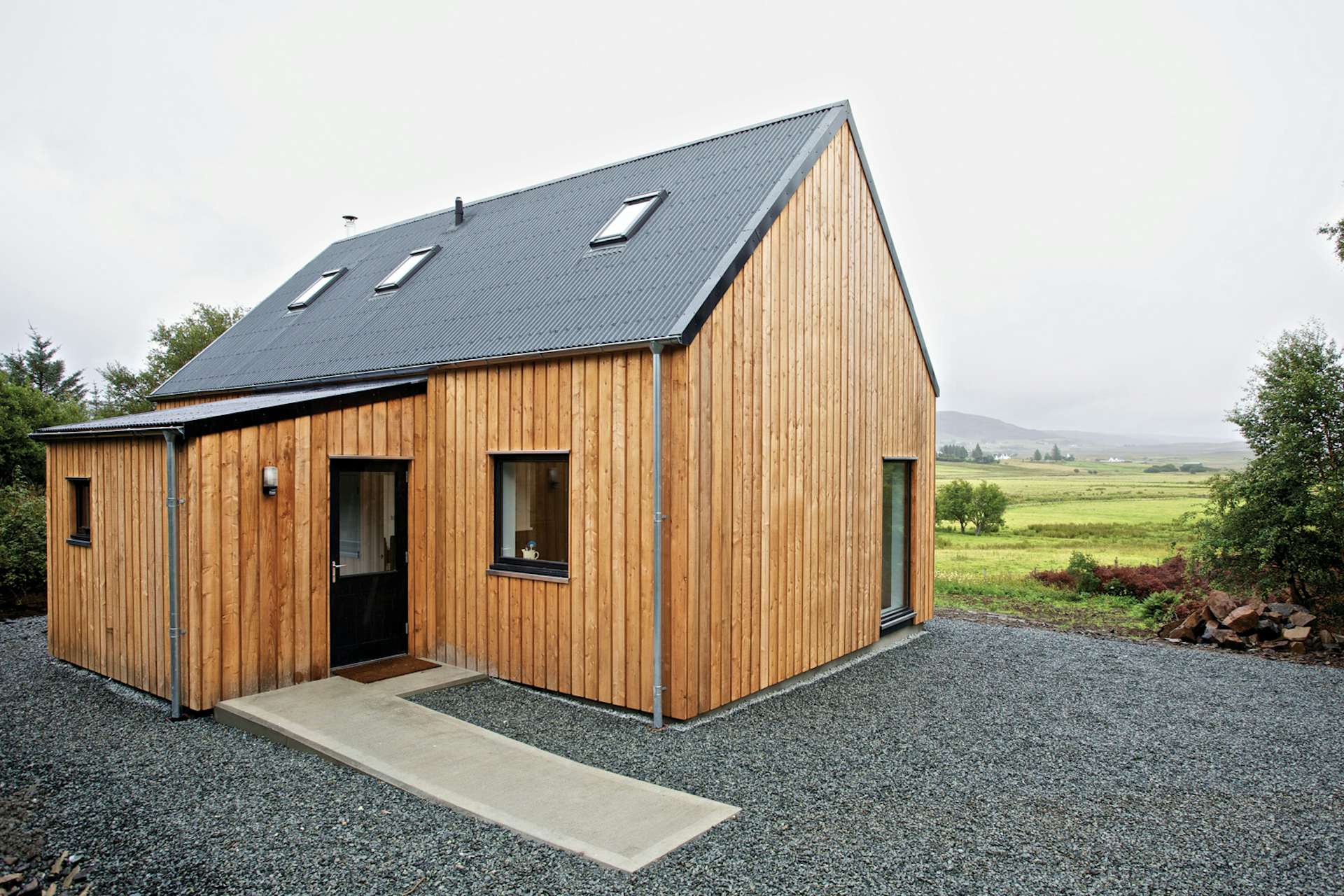 This prefab home on the Isle of Skye in northern Scotland is made mostly from locally sourced materials. The timber-framed model, meant to evoke the simple agrarian barns of the area, can be constructed on-site in as little as one day.