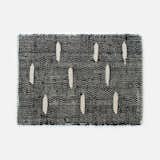 Spotted Rug in black, $69 someware.com

Give some seriously laidback vibes with this 19.5"x3-" rug that was handwoven and dyed by artisans in Santander, Colombia. The accent carpet is made from fique, a plant fiber that, similar to agave sisal, is native to South America.
