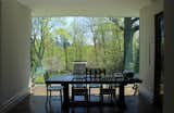 In the dining area, a single glass expanse provides a view to the backyard. "All of our efforts surrounding the glass are to make spaces have no visual barriers between inside and outside," says Provenzano.