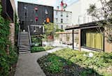 Outdoor, Back Yard, Hardscapes, Garden, Walkways, and Gardens Architect Damien Brambilla turned a run-down Paris apartment building into an open, bright adolescent group home with a landscaped garden.  Photo 1 of 10 in How California Style Influenced a Group Home in Paris