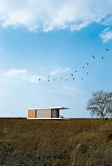 Exterior, Wood Siding Material, Prefab Building Type, and Flat RoofLine “One of the goals of Zenkaya was to create employment in a country crippled by [an unemployment rate of over 25 percent],” explains the architect, who likes to call himself a social entrepreneur.  Photo 2 of 4 in Prefab by Donovan Pierce from A Prefab Housing Concept in South Africa