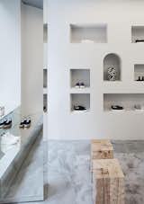 The built-in niches were among the architect's takeaways from a visit to Corbero's residence outside of Barcelona. "You can see [the influence] throughout the store," Wannberg says. "There's a heavy feeling through the grey colorway but with a ceratin lightness in shapes and details." The shoes were created in collaboration with South African artist Esther Mahlangu.