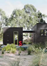 For her family’s house near Melbourne, Anna Horne created a series of prefab wood modules using a design from the company Prebuilt. She found the old industrial letter at a factory; it stands for Somerset, the name of the house.