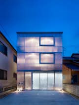 A glowing home in Japan has milky-white, one-and-a-half-inch plastic sheets wrapped around the exterior to let in light and provide insulation.