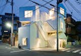 Resembling a jumble of houses piled on top of one another, this dynamic apartment building designed by the architect Sou Fujimoto evokes the chaos and crowding of its setting, Tokyo. Adding to the complexity, the units do not correspond to the house forms. Instead, stairs and ladders link individual tenant spaces that span the different pitched-roof volumes. The building sits on a corner in a residential neighborhood.