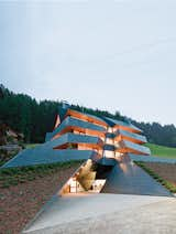 In the Dolomite mountains, an angular copper-clad apartment building echoes the topography of its site. Photos by Hertha Hurnaus