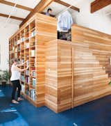 California homeowners Lynda and Peter Benoit designed a functional wooden structure to store books, keepsakes, and clothes. Photo by: Drew Kelly  Photo 5 of 5 in Lofts Worth a Second Look by Jami Smith from Best of #ModernMonday: The Changing Modern Home