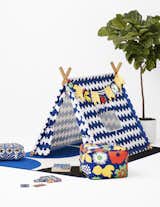 The collection includes a Play Tent, seen here in a Lokki print, along with accessories like pillows, poufs, towels, and a memory card game.