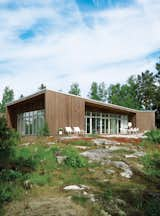 Exterior, House Building Type, Wood Siding Material, and Prefab Building Type Prefab house in Muskö, Sweden  Photo 7 of 7 in Houses With Distinctive Roofs by William Harrison from An Asymmetrical Prefab Home in Sweden