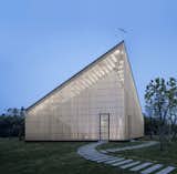 AZL Architects designed a riverfront chapel in Nanjing that glows like a lantern thanks to a semi-transparent wood skin wrapped around a volume that peaks in a 40-foot-high V. [via Inhabitat]