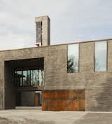 The circa-2011 Bøler church in Oslo, Norway, was designed by Hansen-Bjørndal Arkitekter AS with three main volumes: a church hall on a plateau, a ground-floor congregational hall, and a chapel carved out of the earth. [via Arch Daily]