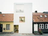 Designed by Stockholm-based architects Johan Oscarson and Jonas Elding in Landskrona, Sweden, this 1,300-square-foot townhouse, completed in 2009, presents an elegant approach to urban infill. Tucked between two older buildings, the stark, white structure sits in an 800-square-foot lot that measures just 15 feet wide.  Photo 9 of 13 in I Want To Go To There by Jenna from Small City Homes, All Under 1,300 Square Feet