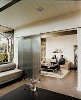 Garcetti and Wakeland enjoy a quiet afternoon, sitting in what used to be two separate bedrooms. By removing a wall, the space now serves as an office and den, divided only by sliding doors.