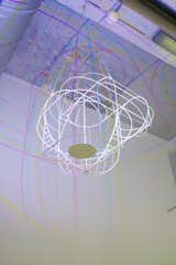 Dennis Parren, a former graphic designer and illustrator, created the CMYK Sculpture, a chandelier that casts split-colored shadows. Parren applied filters to the LED bulbs based on his knowledge of additive and subtractive light, pigment color theories, and how cyan (C), magenta (M), yellow (Y) and black (K) interact. This important lighting innovation could someday be used for mood-altering light therapies.  Search “big bang chandelier” from 16 Groundbreaking Dutch Designers to Know Now